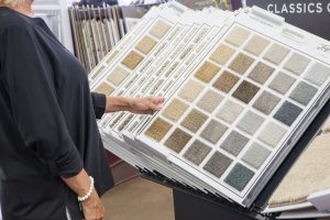 Woman looking at carpet samples